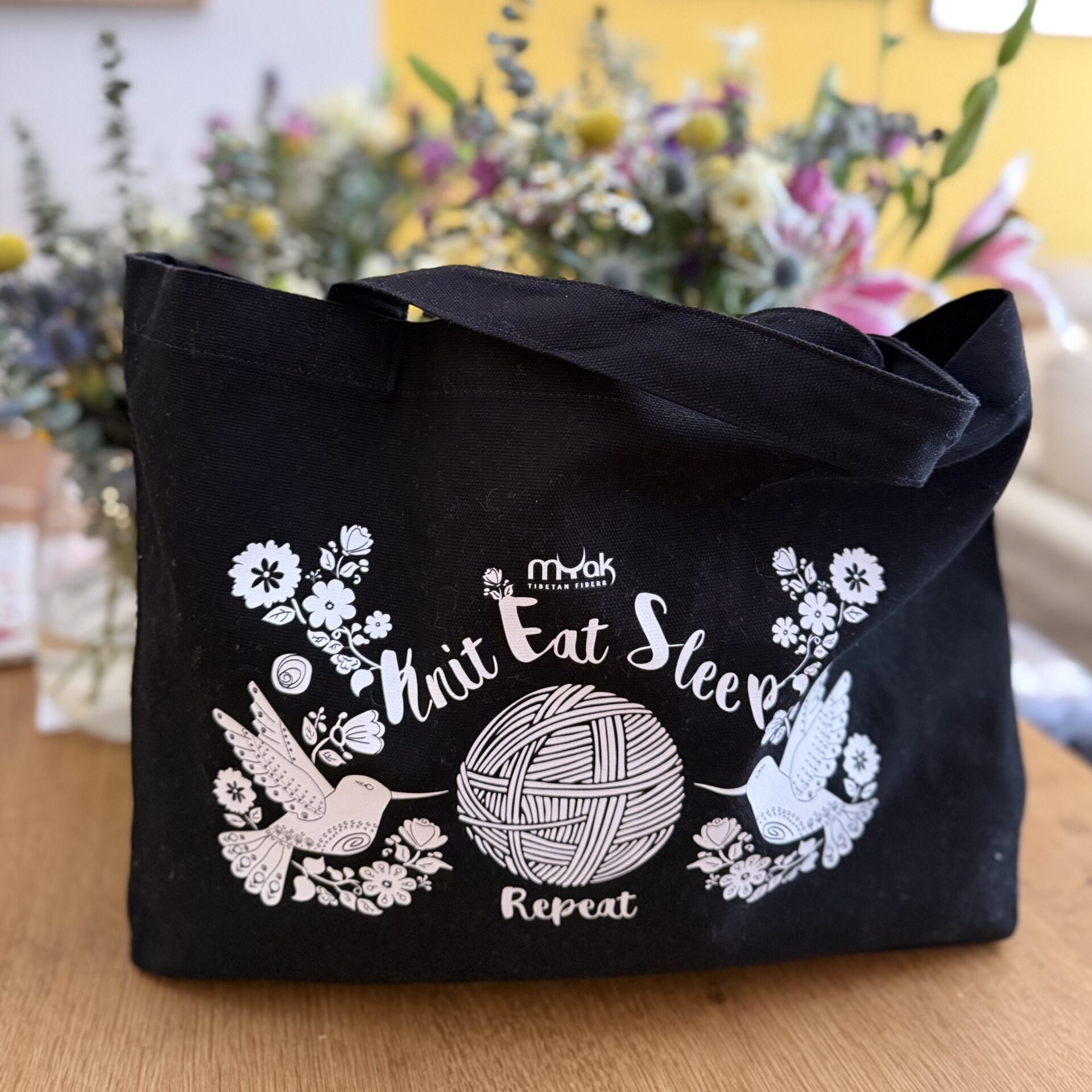 hop our limited-edition mYak Tote Bags! Durable canvas featuring a hand-drawn "Knit, Eat, Sleep, Repeat" design. Perfect for large projects. Grab yours!